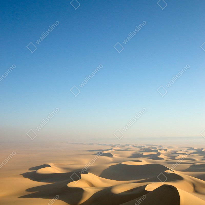 Naklejka na drzwi niekończące się wydmy pustyni pod błękitnym niebem – Wallissimo® Naklejka na drzwi niekończące się wydmy pustyni pod błękitnym niebem – Wallissimo®