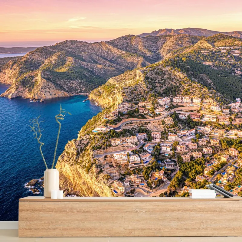 Fototapeta zachód słońca nad klifem i nadmorską wioską