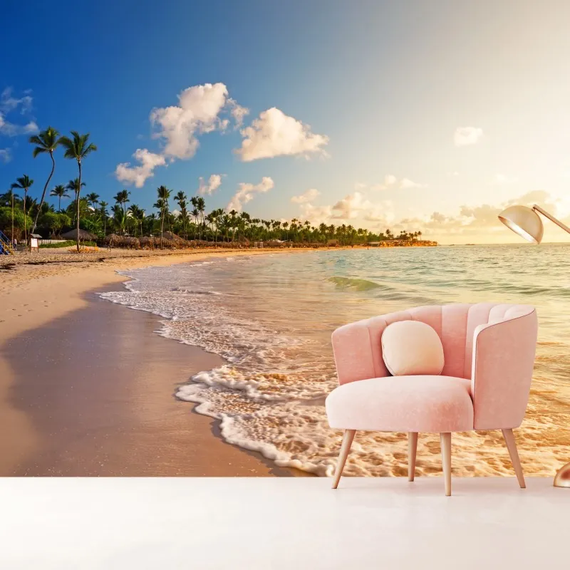 Fototapeta tropikalny zachód słońca na plaży z sylwetkami palm