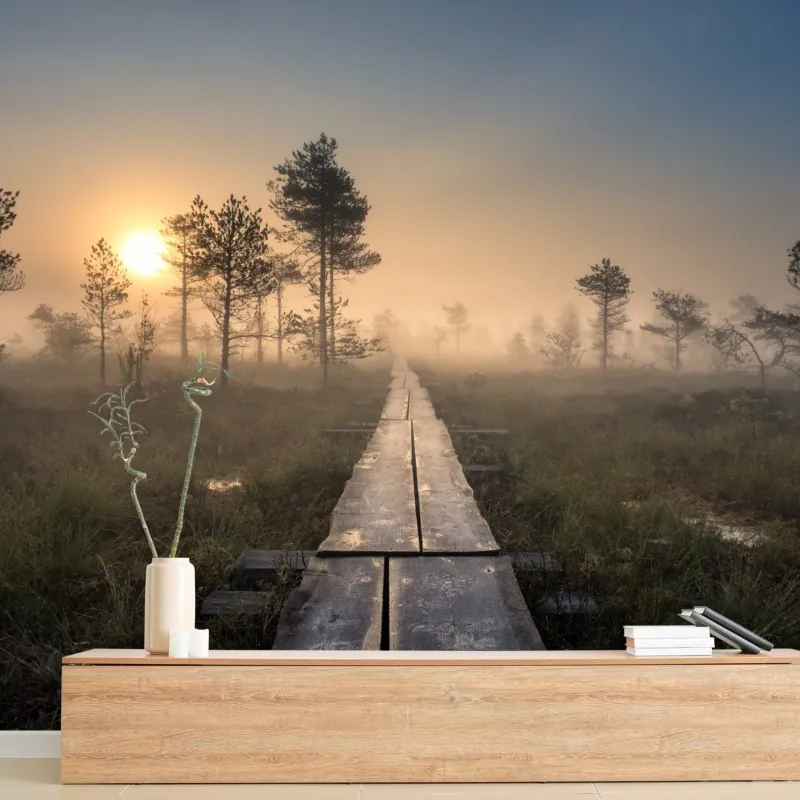 Fototapeta mglisty wschód słońca nad drewnianą kładką
