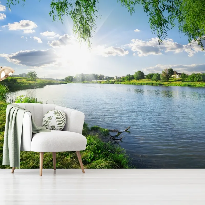 Fototapeta nasłoneczniony brzeg rzeki z bujną zielenią