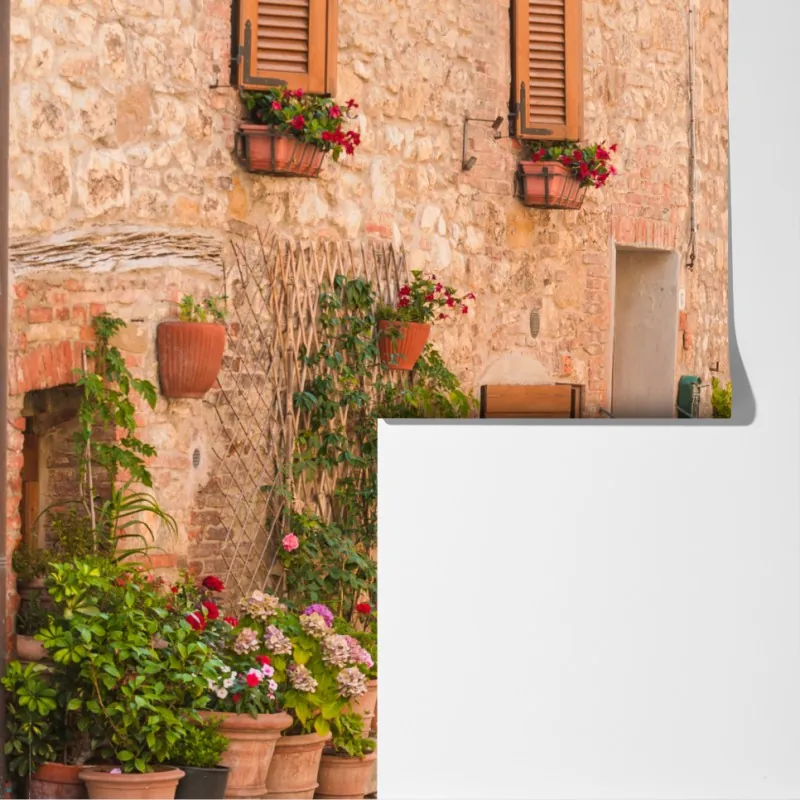 Fototapeta średniowieczna ulica w Toskanii z doniczkami z kwiatami – Wallissimo® Fototapeta średniowieczna ulica w Toskanii z doniczkami z kwiatami – Wallissimo®