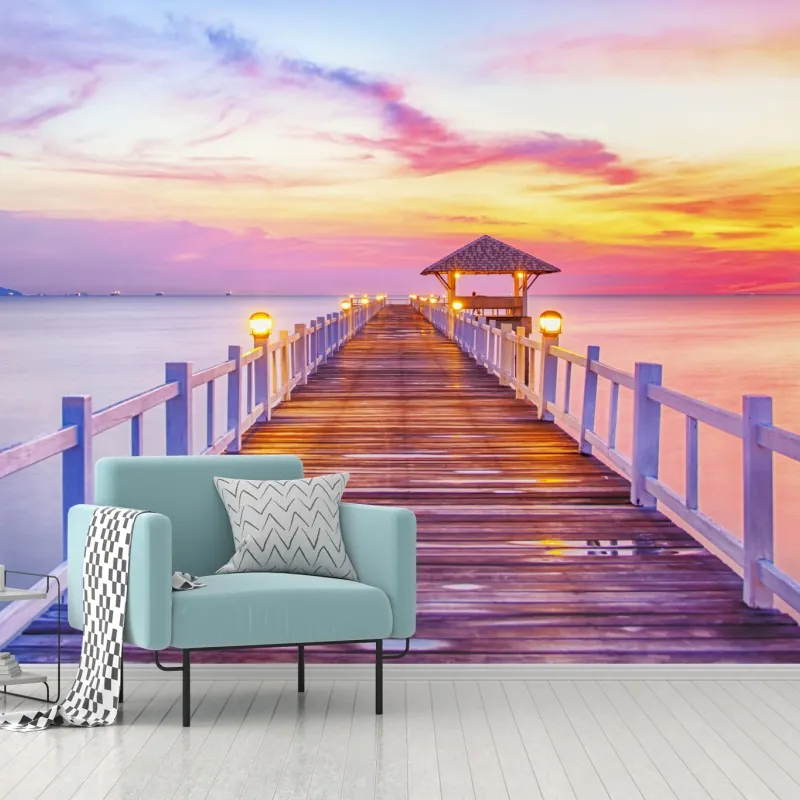 Fototapeta molo o zachodzie słońca nad spokojnym horyzontem