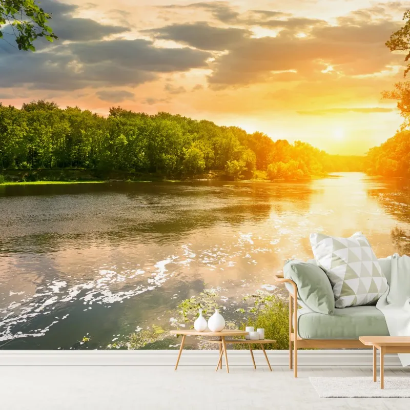 Fototapeta spokojny zachód słońca nad rzeką i zielonym lasem