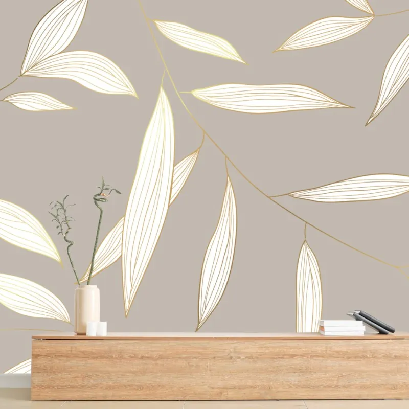 Wall mural delicate gold-lined leaves on beige background