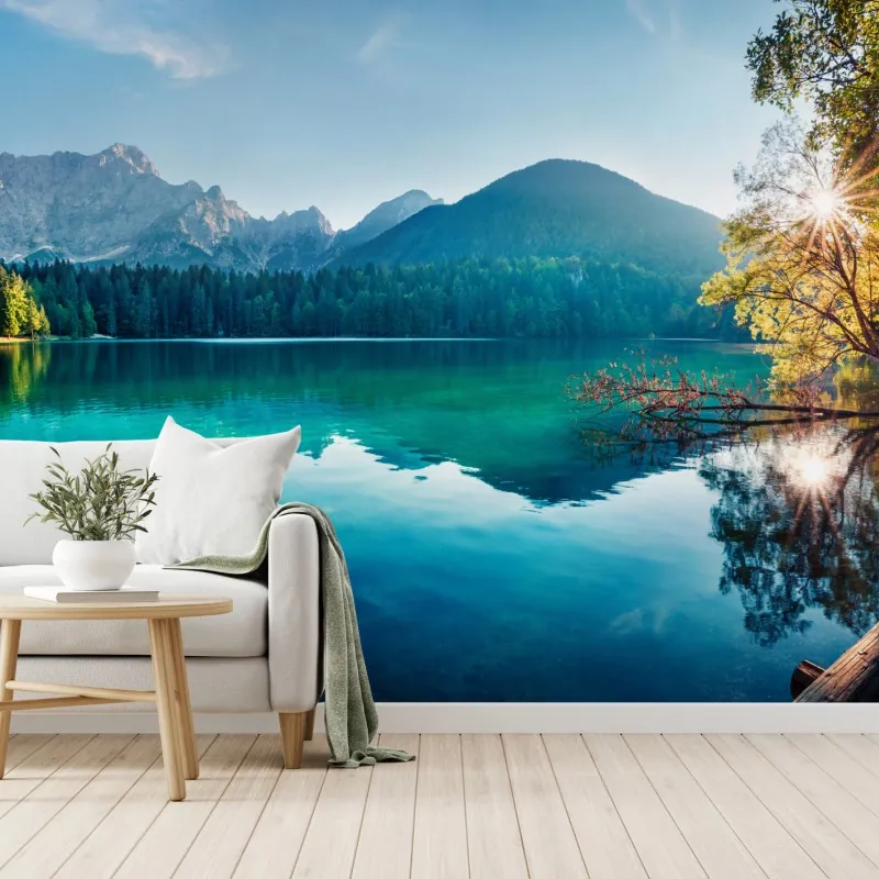 Wall mural sunlit Fusine lake, Julian Alps morning panorama