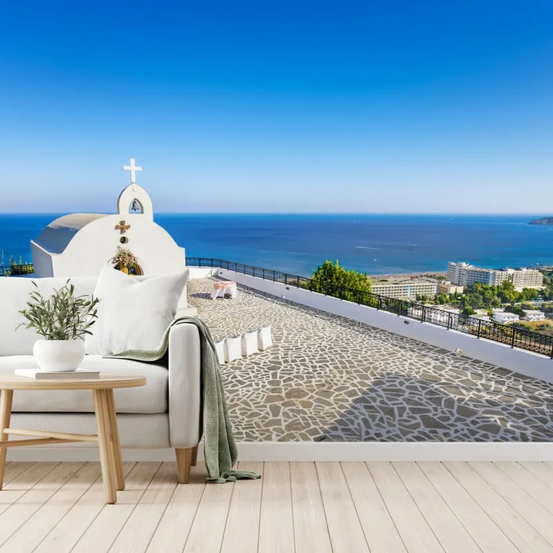 Wall mural white chapel overlooking the sea in Faliraki