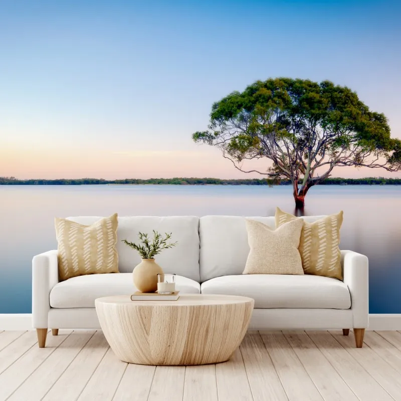 Wall mural solitary tree over a tranquil lake