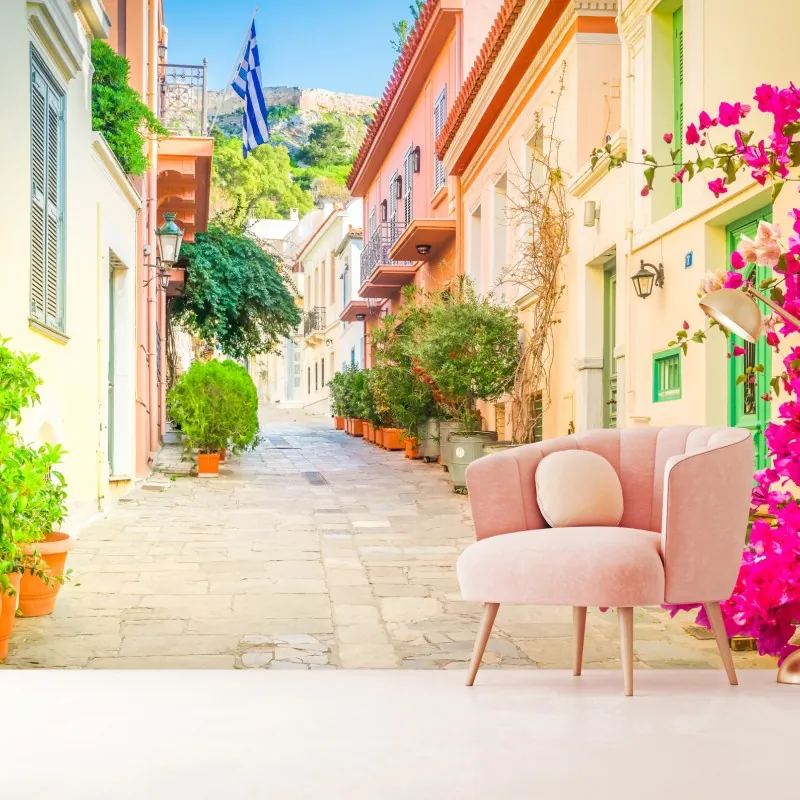 Wall mural sunlit Greek alley with bougainvillea