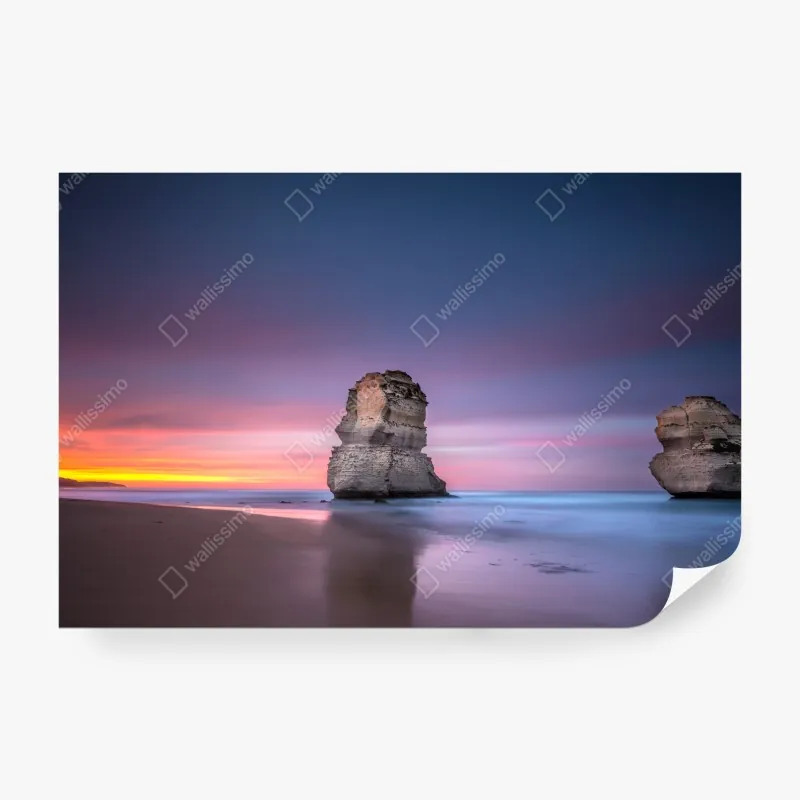 Wall mural serene coastal rock formations at sunset