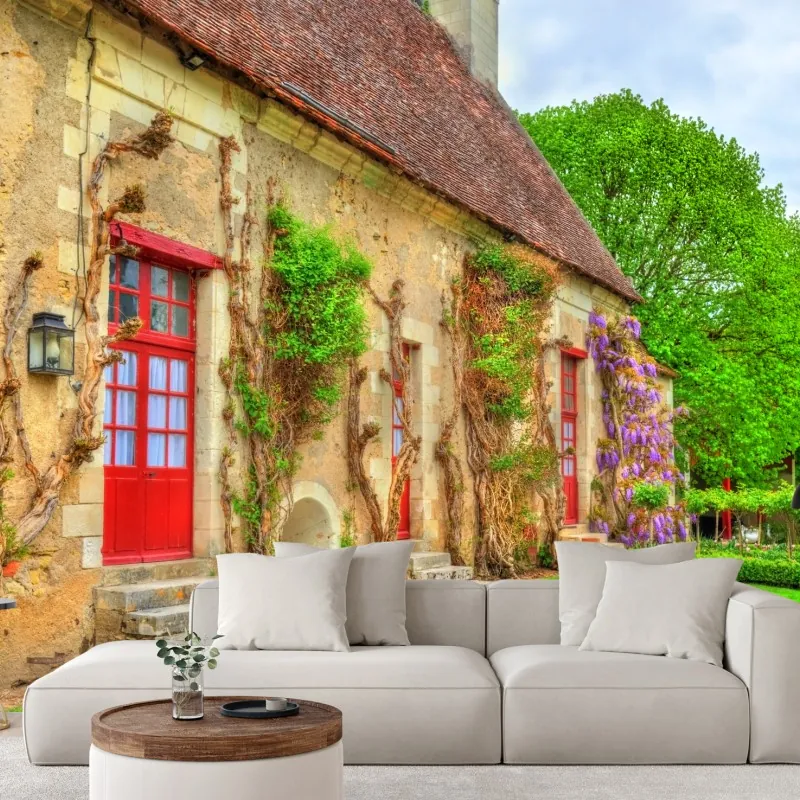 Wall mural charming cottage with wisteria in bloom