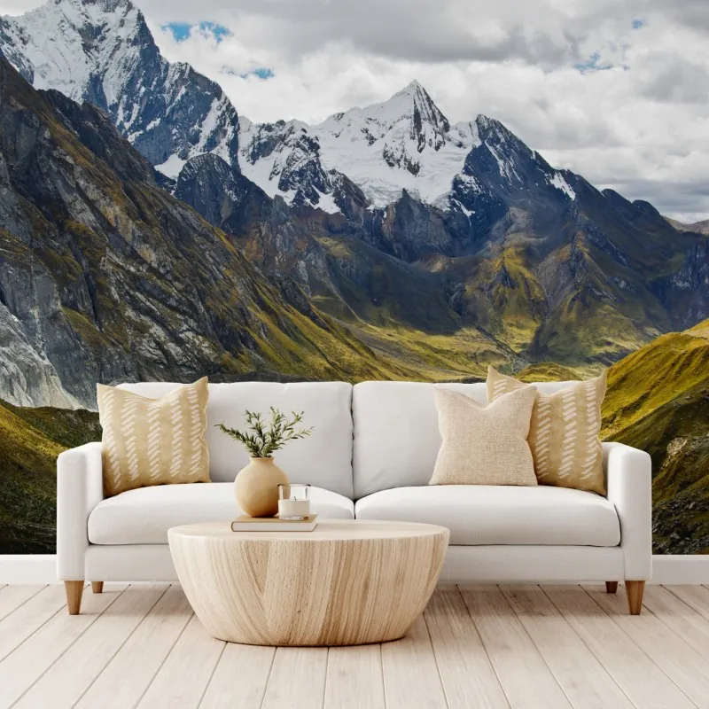Wall mural turquoise alpine lake beneath snowy peaks