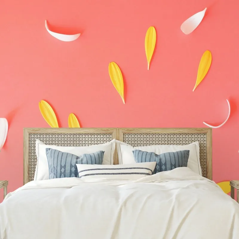 Wall mural sunny yellow gerbera on coral background