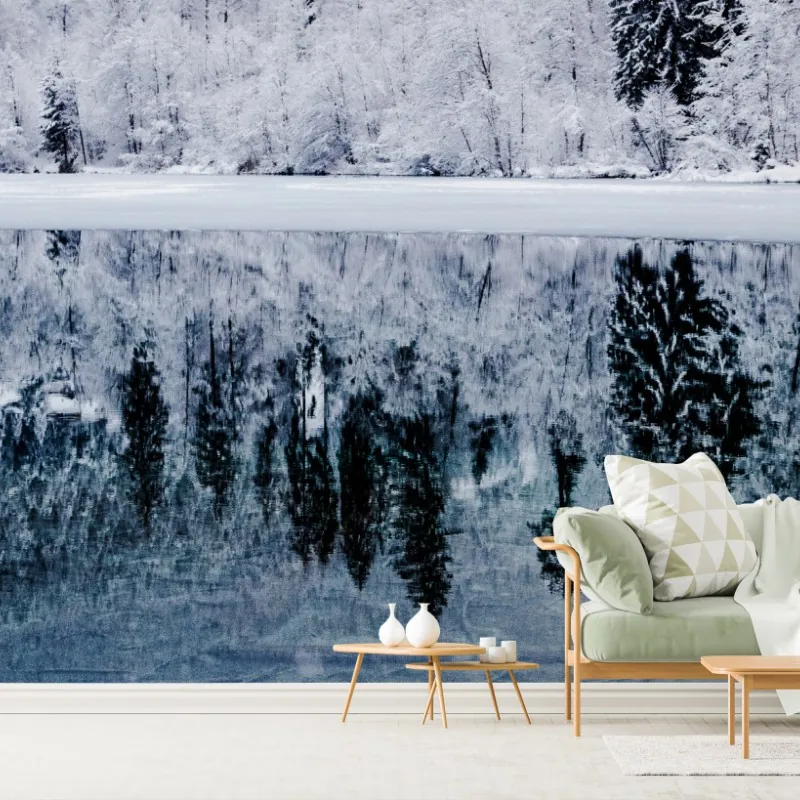 Wall mural winter lake reflection in snowy forest