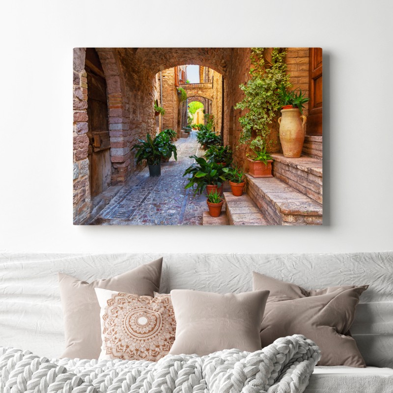 Obraz na płótnie słoneczna uliczka z doniczkami w Spello – Wallissimo® Obraz na płótnie słoneczna uliczka z doniczkami w Spello – Wallissimo®
