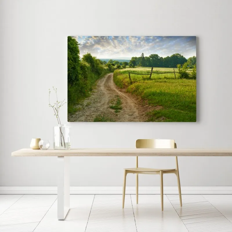 Obraz na płótnie słoneczna wiejska ścieżka przez zielone łąki – Wallissimo® Obraz na płótnie słoneczna wiejska ścieżka przez zielone łąki – Wallissimo®